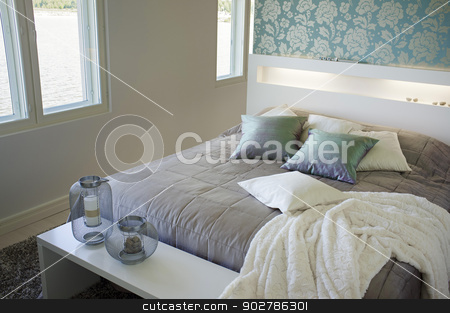 To use this stock image in your creative project, please select the size you need over to the right and click the "Add to Cart" button.
Your downloaded image will come with the Cutcaster watermark removed so don’t worry about the watermark you see on this page. Bedroom stock photo, Contemporary small bedroom interior decor. by Stocksnapper