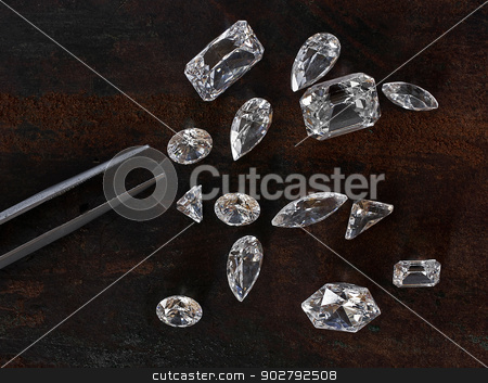 To use this stock image in your creative project, please select the size you need over to the right and click the "Add to Cart" button.
Your downloaded image will come with the Cutcaster watermark removed so don’t worry about the watermark you see on this page. diamonds and tweezers stock photo, few diamonds over leather background and a tweezers by RedDaxLuma