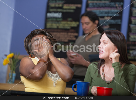 To use this stock image in your creative project, please select the size you need over to the right and click the "Add to Cart" button.
Your downloaded image will come with the Cutcaster watermark removed so don’t worry about the watermark you see on this page. Laughing Friends in Cafe stock photo, Laughing African woman with European woman in cafe by Scott Griessel