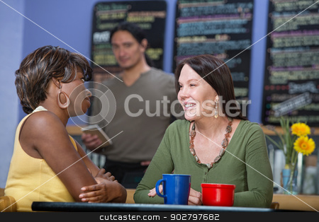 To use this stock image in your creative project, please select the size you need over to the right and click the "Add to Cart" button.
Your downloaded image will come with the Cutcaster watermark removed so don’t worry about the watermark you see on this page. Pretty Women Talking stock photo, Two pretty diverse female cafe customers talking by Scott Griessel
