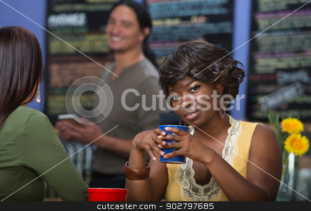 To use this stock image in your creative project, please select the size you need over to the right and click the "Add to Cart" button.
Your downloaded image will come with the Cutcaster watermark removed so don’t worry about the watermark you see on this page. Grinning Woman with Coffee stock photo, Grinning African woman with coffee mug in cafe by Scott Griessel