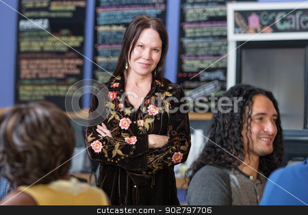 To use this stock image in your creative project, please select the size you need over to the right and click the "Add to Cart" button.
Your downloaded image will come with the Cutcaster watermark removed so don’t worry about the watermark you see on this page. Cute Woman with Folded Arms in Cafe stock photo, Beautiful mature woman standing in coffee house by Scott Griessel