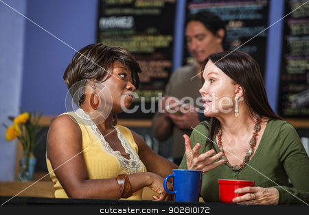 To use this stock image in your creative project, please select the size you need over to the right and click the "Add to Cart" button.
Your downloaded image will come with the Cutcaster watermark removed so don’t worry about the watermark you see on this page. Diverse Friends Talking in Cafe stock photo, African and European women in a coffee house talking by Scott Griessel