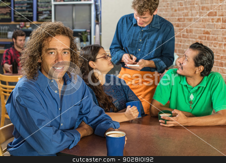 To use this stock image in your creative project, please select the size you need over to the right and click the "Add to Cart" button.
Your downloaded image will come with the Cutcaster watermark removed so don’t worry about the watermark you see on this page. Man with Friends and Barista stock photo, Grinning man with friends and barista at cafe by Scott Griessel