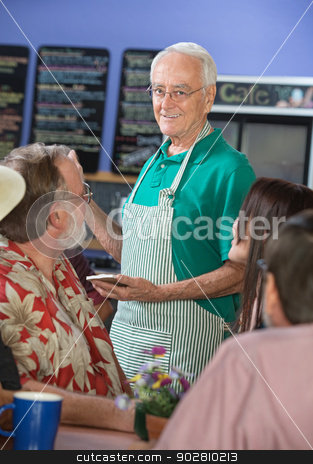 To use this stock image in your creative project, please select the size you need over to the right and click the "Add to Cart" button.
Your downloaded image will come with the Cutcaster watermark removed so don’t worry about the watermark you see on this page. Smiling Cafe Worker with Customers stock photo, Older cafe worker with patrons in restaurant by Scott Griessel