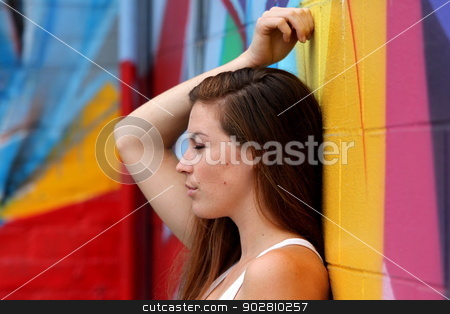 To use this stock image in your creative project, please select the size you need over to the right and click the "Add to Cart" button.
Your downloaded image will come with the Cutcaster watermark removed so don’t worry about the watermark you see on this page. Portrait Of A Woman stock photo, Side view portrait of a woman with colorful wall in the background. by Henrik Lehnerer