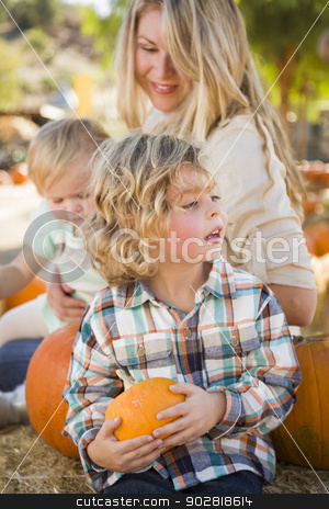 To use this stock image in your creative project, please select the size you need over to the right and click the "Add to Cart" button.
Your downloaded image will come with the Cutcaster watermark removed so don’t worry about the watermark you see on this page. Young Family Enjoys a Day at the Pumpkin Patch stock photo, Adorable Young Family Enjoys a Day at the Pumpkin Patch. by Andy Dean