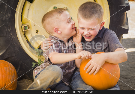 To use this stock image in your creative project, please select the size you need over to the right and click the "Add to Cart" button.
Your downloaded image will come with the Cutcaster watermark removed so don’t worry about the watermark you see on this page. Two Boys Sitting Against Tractor Tire Holding Pumpkins Whisperin stock photo, Two Boys Sitting Against a Tractor Tire Holding Pumpkins and Whispering Secrets in Rustic Setting. by Andy Dean