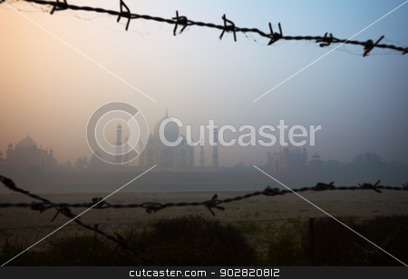 To use this stock image in your creative project, please select the size you need over to the right and click the "Add to Cart" button.
Your downloaded image will come with the Cutcaster watermark removed so don’t worry about the watermark you see on this page. Taj Mahal from the riverside, trough barbed wire stock photo, View of the Taj Mahal from the riverside, trough barbed wire by Alexey Romanov