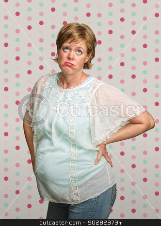 To use this stock image in your creative project, please select the size you need over to the right and click the "Add to Cart" button.
Your downloaded image will come with the Cutcaster watermark removed so don’t worry about the watermark you see on this page. Frustrated Pregnant Woman stock photo, Pregnant European female with eyes rolled up by Scott Griessel