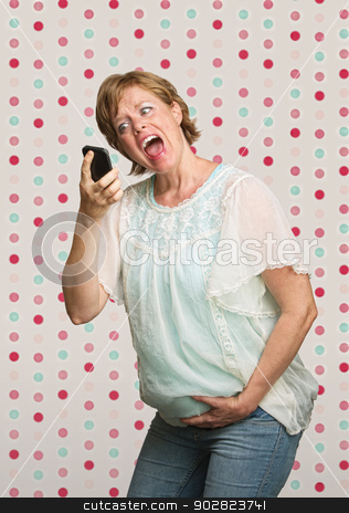 To use this stock image in your creative project, please select the size you need over to the right and click the "Add to Cart" button.
Your downloaded image will come with the Cutcaster watermark removed so don’t worry about the watermark you see on this page. Pregnant Woman Yelling at Phone stock photo, Pregnant woman holding belly while yelling at phone by Scott Griessel