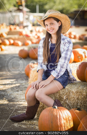To use this stock image in your creative project, please select the size you need over to the right and click the "Add to Cart" button.
Your downloaded image will come with the Cutcaster watermark removed so don’t worry about the watermark you see on this page. Preteen Girl Portrait at the Pumpkin Patch stock photo, Preteen Girl Wearing Cowboy Hat Portrait at the Pumpkin Patch in a Rustic Setting. by Andy Dean
