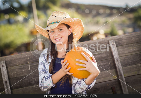 To use this stock image in your creative project, please select the size you need over to the right and click the "Add to Cart" button.
Your downloaded image will come with the Cutcaster watermark removed so don’t worry about the watermark you see on this page. Preteen Girl Portrait at the Pumpkin Patch stock photo, Preteen Girl Wearing Cowboy Hat Portrait at the Pumpkin Patch in a Rustic Setting. by Andy Dean