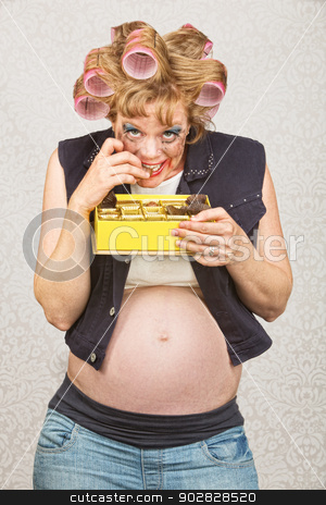 To use this stock image in your creative project, please select the size you need over to the right and click the "Add to Cart" button.
Your downloaded image will come with the Cutcaster watermark removed so don’t worry about the watermark you see on this page. Smiling Pregnant Hick stock photo, Smiling pregnant lady in curlers eating chocolates by Scott Griessel