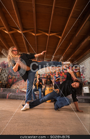 To use this stock image in your creative project, please select the size you need over to the right and click the "Add to Cart" button.
Your downloaded image will come with the Cutcaster watermark removed so don’t worry about the watermark you see on this page. Male Capoeiristas Kicking stock photo, Male capoeira martial artists practicing kicking techniques by Scott Griessel