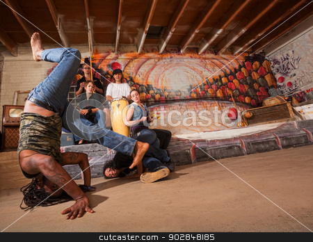 To use this stock image in your creative project, please select the size you need over to the right and click the "Add to Cart" button.
Your downloaded image will come with the Cutcaster watermark removed so don’t worry about the watermark you see on this page. Acrobatic Capoeira Performers stock photo, Acrobatic group of capoeira performers in building by Scott Griessel