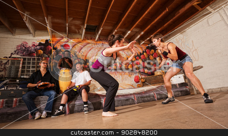 To use this stock image in your creative project, please select the size you need over to the right and click the "Add to Cart" button.
Your downloaded image will come with the Cutcaster watermark removed so don’t worry about the watermark you see on this page. Female Capoeira Martial Artists stock photo, Female capoeira martial artists and musicians performing indoors by Scott Griessel