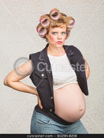 To use this stock image in your creative project, please select the size you need over to the right and click the "Add to Cart" button.
Your downloaded image will come with the Cutcaster watermark removed so don’t worry about the watermark you see on this page. Serious Pregnant Hillbilly stock photo, Serious pregnant female in curlers with hands on hips by Scott Griessel