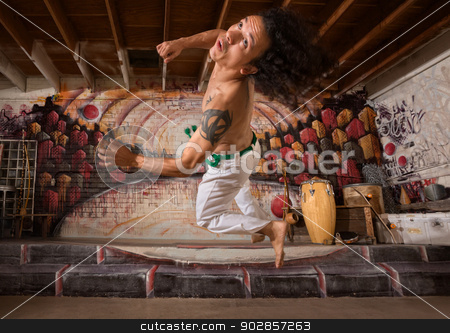 To use this stock image in your creative project, please select the size you need over to the right and click the "Add to Cart" button.
Your downloaded image will come with the Cutcaster watermark removed so don’t worry about the watermark you see on this page. Man Jumping Up stock photo, Muscular male capoeira export jumping and twisting by Scott Griessel