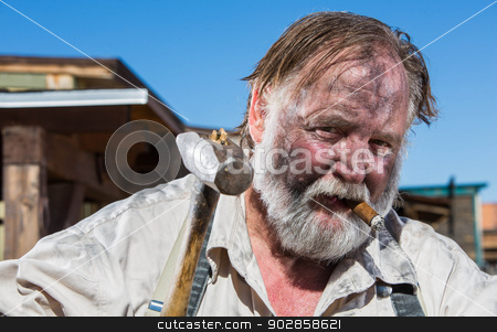 To use this stock image in your creative project, please select the size you need over to the right and click the "Add to Cart" button.
Your downloaded image will come with the Cutcaster watermark removed so don’t worry about the watermark you see on this page. Old West Blacksmith stock photo, Old West Blacksmith Smokes a Cigar by Scott Griessel