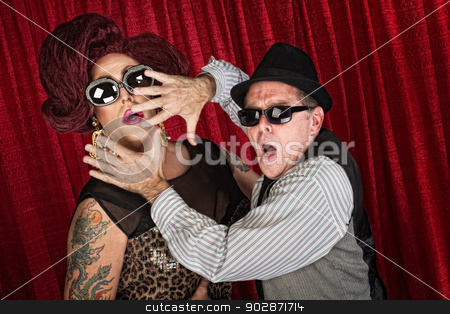 To use this stock image in your creative project, please select the size you need over to the right and click the "Add to Cart" button.
Your downloaded image will come with the Cutcaster watermark removed so don’t worry about the watermark you see on this page. Surprised Famous Couple stock photo, Surprised drag queen and partner in sunglasses by Scott Griessel