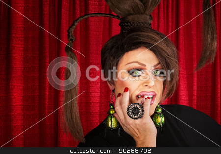 To use this stock image in your creative project, please select the size you need over to the right and click the "Add to Cart" button.
Your downloaded image will come with the Cutcaster watermark removed so don’t worry about the watermark you see on this page. Drag Queen Staring stock photo, Beautiful drag queen staring and biting nails by Scott Griessel