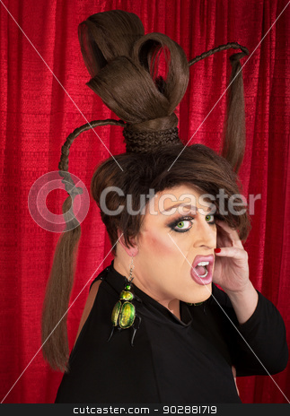 To use this stock image in your creative project, please select the size you need over to the right and click the "Add to Cart" button.
Your downloaded image will come with the Cutcaster watermark removed so don’t worry about the watermark you see on this page. Surprised Man with Large Earrings stock photo, Surprised man in drag with ponytails and large earrings by Scott Griessel