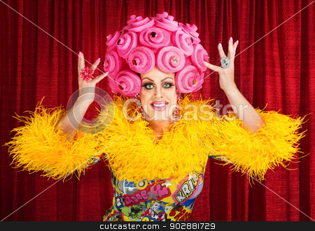 To use this stock image in your creative project, please select the size you need over to the right and click the "Add to Cart" button.
Your downloaded image will come with the Cutcaster watermark removed so don’t worry about the watermark you see on this page. Happy Drag Queen Performing stock photo, Happy man in dress and pink foam wig performing by Scott Griessel