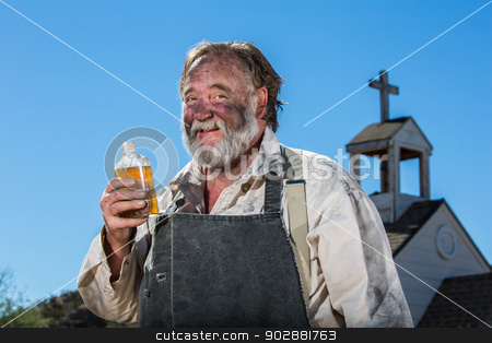 To use this stock image in your creative project, please select the size you need over to the right and click the "Add to Cart" button.
Your downloaded image will come with the Cutcaster watermark removed so don’t worry about the watermark you see on this page. Old West Drunkard Drinks stock photo, Old West Drunkard Drinks a Bottle of Alchohol by Scott Griessel