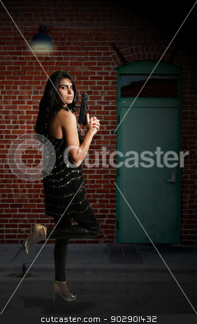 To use this stock image in your creative project, please select the size you need over to the right and click the "Add to Cart" button.
Your downloaded image will come with the Cutcaster watermark removed so don’t worry about the watermark you see on this page. Female Detective stock photo, Beautiful police detective woman on the job with a gun by Robert Byron