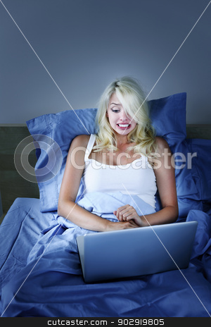 To use this stock image in your creative project, please select the size you need over to the right and click the "Add to Cart" button.
Your downloaded image will come with the Cutcaster watermark removed so don’t worry about the watermark you see on this page. Frightened woman with computer at night stock photo, Scared woman using laptop computer in bed at night by Elena Elisseeva