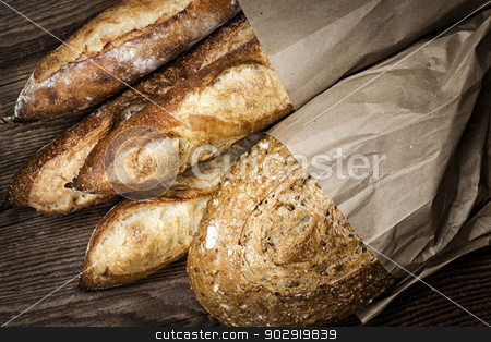 To use this stock image in your creative project, please select the size you need over to the right and click the "Add to Cart" button.
Your downloaded image will come with the Cutcaster watermark removed so don’t worry about the watermark you see on this page. Artisan bread stock photo, Fresh baked rustic bread loaves in paper bags on dark wood background by Elena Elisseeva