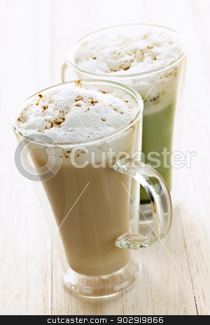 To use this stock image in your creative project, please select the size you need over to the right and click the "Add to Cart" button.
Your downloaded image will come with the Cutcaster watermark removed so don’t worry about the watermark you see on this page. Chai and matcha latte drinks stock photo, Two specialty tea latte beverages of chai and matcha teas by Elena Elisseeva