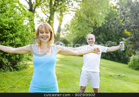 To use this stock image in your creative project, please select the size you need over to the right and click the "Add to Cart" button.
Your downloaded image will come with the Cutcaster watermark removed so don’t worry about the watermark you see on this page. Personal trainer with client exercising outside stock photo, Female fitness instructor exercising with middle aged man outdoors in summer park by Elena Elisseeva