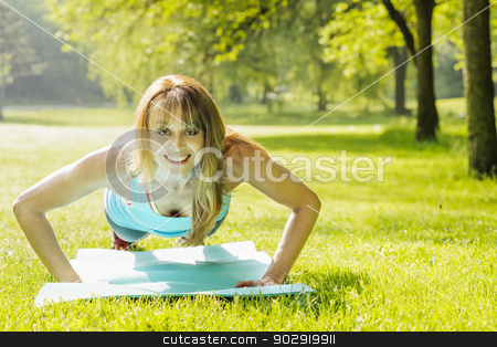 To use this stock image in your creative project, please select the size you need over to the right and click the "Add to Cart" button.
Your downloaded image will come with the Cutcaster watermark removed so don’t worry about the watermark you see on this page. Woman doing pushups in morning park stock photo, Female fitness instructor exercising doing pushups in green summer park by Elena Elisseeva