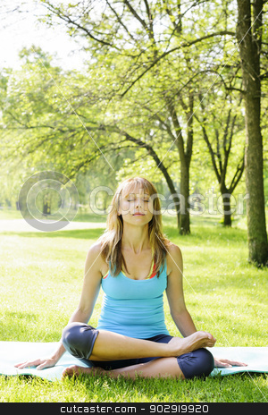To use this stock image in your creative project, please select the size you need over to the right and click the "Add to Cart" button.
Your downloaded image will come with the Cutcaster watermark removed so don’t worry about the watermark you see on this page. Woman in lotus yoga pose outside stock photo, Female fitness instructor in lotus yoga pose outdoor at spring park by Elena Elisseeva