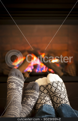 To use this stock image in your creative project, please select the size you need over to the right and click the "Add to Cart" button.
Your downloaded image will come with the Cutcaster watermark removed so don’t worry about the watermark you see on this page. Feet warming by fireplace stock photo, Feet in wool socks warming by cozy fire by Elena Elisseeva