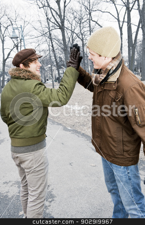 To use this stock image in your creative project, please select the size you need over to the right and click the "Add to Cart" button.
Your downloaded image will come with the Cutcaster watermark removed so don’t worry about the watermark you see on this page. Two men doing high five in park stock photo, Two young men meeting in winter park giving high five by Elena Elisseeva