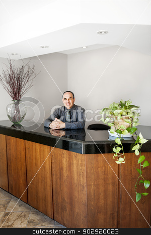 To use this stock image in your creative project, please select the size you need over to the right and click the "Add to Cart" button.
Your downloaded image will come with the Cutcaster watermark removed so don’t worry about the watermark you see on this page. Smiling man standing at office reception stock photo, Businessman standing at reception counter in office by Elena Elisseeva