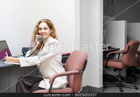 To use this stock image in your creative project, please select the size you need over to the right and click the "Add to Cart" button.
Your downloaded image will come with the Cutcaster watermark removed so don’t worry about the watermark you see on this page. Smiling woman on telephone at office desk stock photo, Businesswoman on phone taking notes in office workstation by Elena Elisseeva