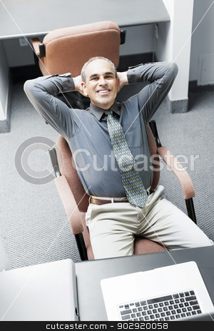 To use this stock image in your creative project, please select the size you need over to the right and click the "Add to Cart" button.
Your downloaded image will come with the Cutcaster watermark removed so don’t worry about the watermark you see on this page. Man sitting at office desk stock photo, Businessman with laptop computer sitting at office workstation by Elena Elisseeva