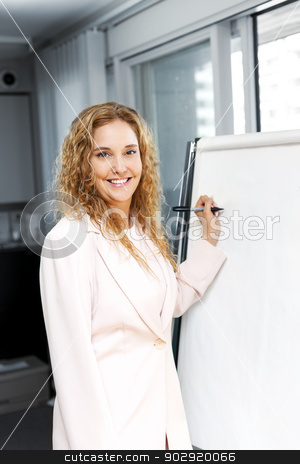 To use this stock image in your creative project, please select the size you need over to the right and click the "Add to Cart" button.
Your downloaded image will come with the Cutcaster watermark removed so don’t worry about the watermark you see on this page. Business woman writing on flip chart stock photo, Smiling businesswoman writing on flip chart paper in office by Elena Elisseeva