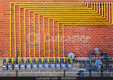 To use this stock image in your creative project, please select the size you need over to the right and click the "Add to Cart" button.
Your downloaded image will come with the Cutcaster watermark removed so don’t worry about the watermark you see on this page. Gas meters on brick wall stock photo, Row of natural gas meters with yellow pipes on building brick wall by Elena Elisseeva