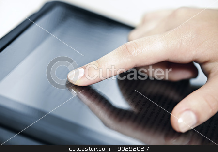 To use this stock image in your creative project, please select the size you need over to the right and click the "Add to Cart" button.
Your downloaded image will come with the Cutcaster watermark removed so don’t worry about the watermark you see on this page. Tablet computer with hand stock photo, Female hand touching tablet computer screen with finger by Elena Elisseeva