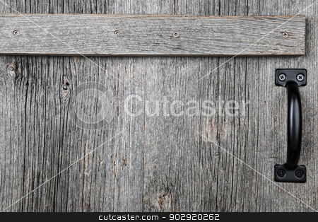 To use this stock image in your creative project, please select the size you need over to the right and click the "Add to Cart" button.
Your downloaded image will come with the Cutcaster watermark removed so don’t worry about the watermark you see on this page. Old barn wood door stock photo, Distressed rustic barn wood door with handle as textured background by Elena Elisseeva