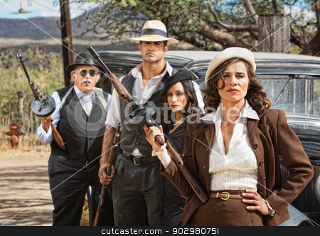 To use this stock image in your creative project, please select the size you need over to the right and click the "Add to Cart" button.
Your downloaded image will come with the Cutcaster watermark removed so don’t worry about the watermark you see on this page. Diverse 1920s Era Gangsters stock photo, Four diverse 1920s vintage gangsters outside by Scott Griessel