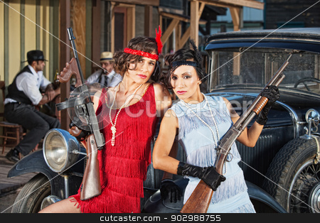 To use this stock image in your creative project, please select the size you need over to the right and click the "Add to Cart" button.
Your downloaded image will come with the Cutcaster watermark removed so don’t worry about the watermark you see on this page. Attractive Female Gangsters with Guns stock photo, 1920s attractive female gangsters with rifle and submachine gun by Scott Griessel