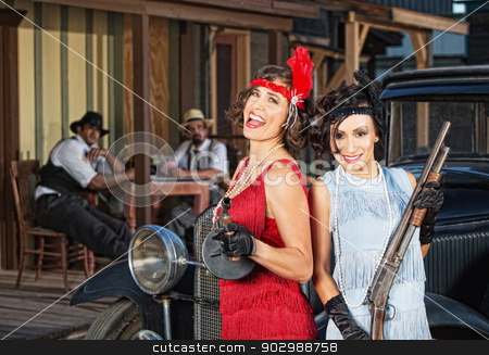 To use this stock image in your creative project, please select the size you need over to the right and click the "Add to Cart" button.
Your downloaded image will come with the Cutcaster watermark removed so don’t worry about the watermark you see on this page. Laughing Female Gangsters stock photo, Pair of laughing 1920s gangster women with guns by Scott Griessel