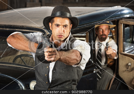 To use this stock image in your creative project, please select the size you need over to the right and click the "Add to Cart" button.
Your downloaded image will come with the Cutcaster watermark removed so don’t worry about the watermark you see on this page. Tough 1920s Era Gangsters with Weapons stock photo, Tough 1920s vintage gangsters by car with weapons by Scott Griessel