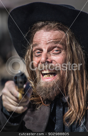 To use this stock image in your creative project, please select the size you need over to the right and click the "Add to Cart" button.
Your downloaded image will come with the Cutcaster watermark removed so don’t worry about the watermark you see on this page. Cowboy Points Gun at You stock photo, Cowboy Laughs While He Points Gun at You by Scott Griessel